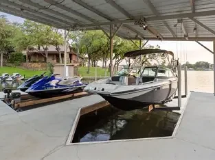 Technician treating a boat dock for spider prevention